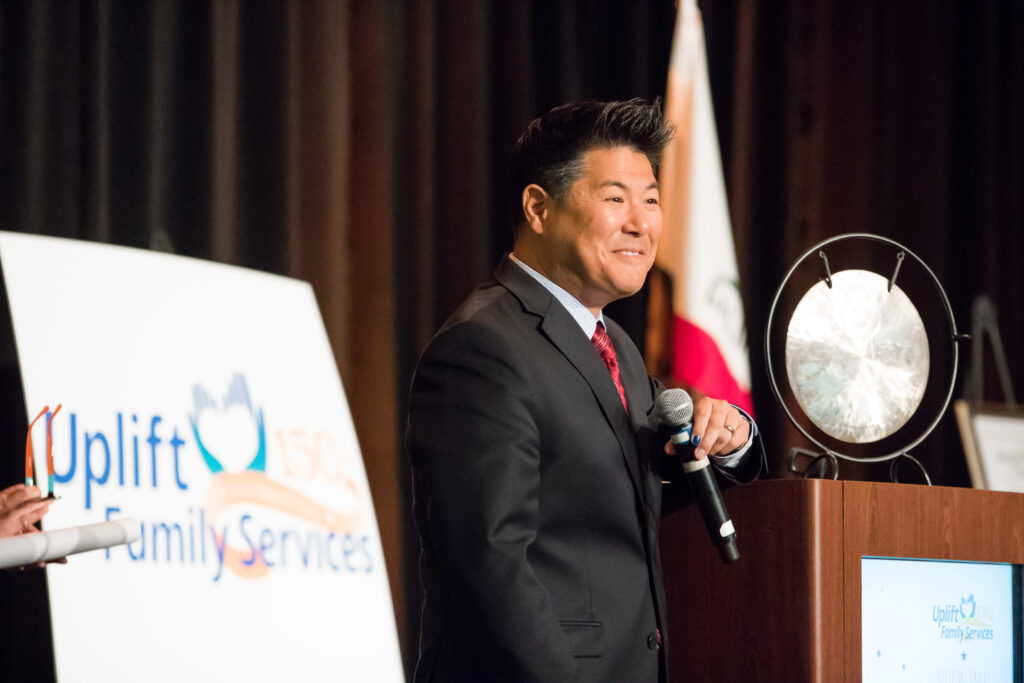 a man speaking at a podium