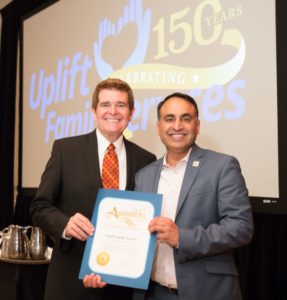 Ash Kalra et al. holding a certificate