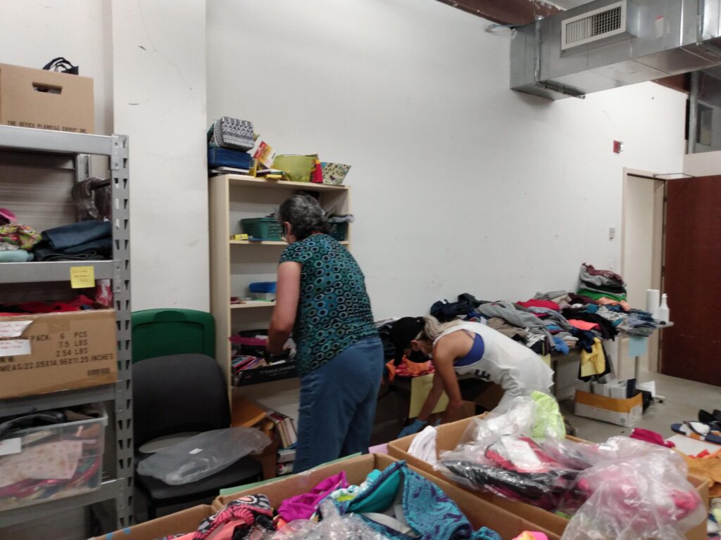 volunteer stack christmas in july items on shelves