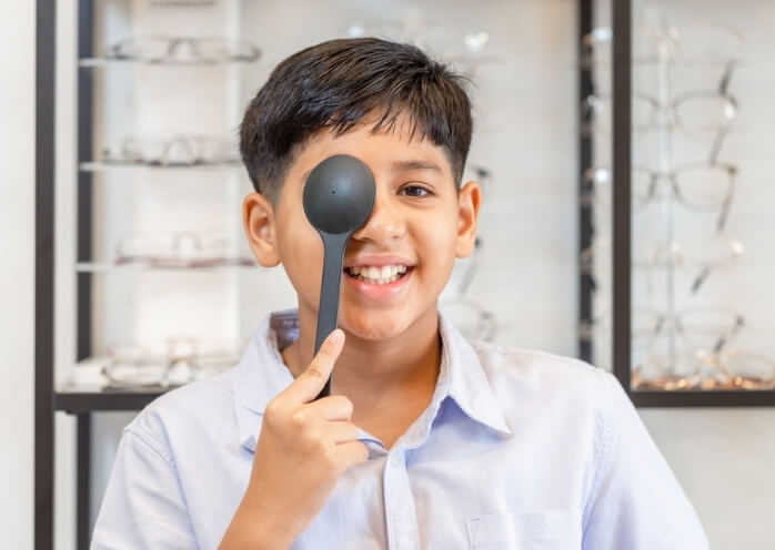 Children cover left eye