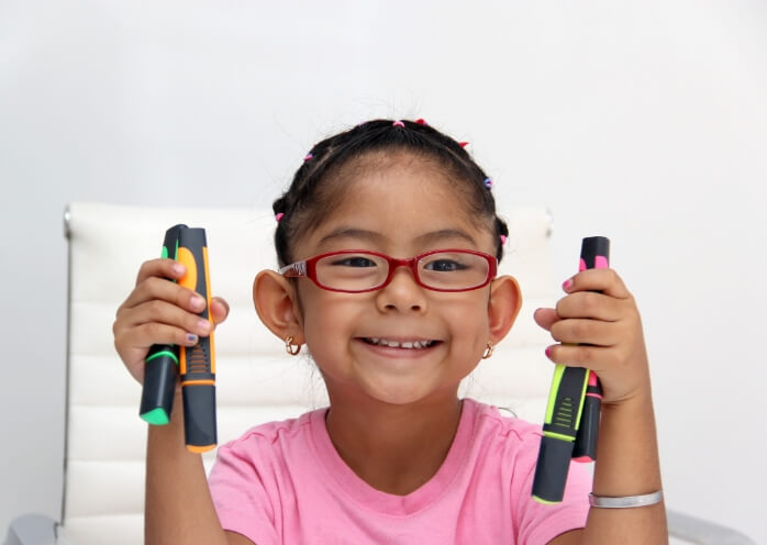 Children handling pens