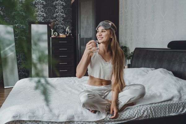 woman drinking early in the morning