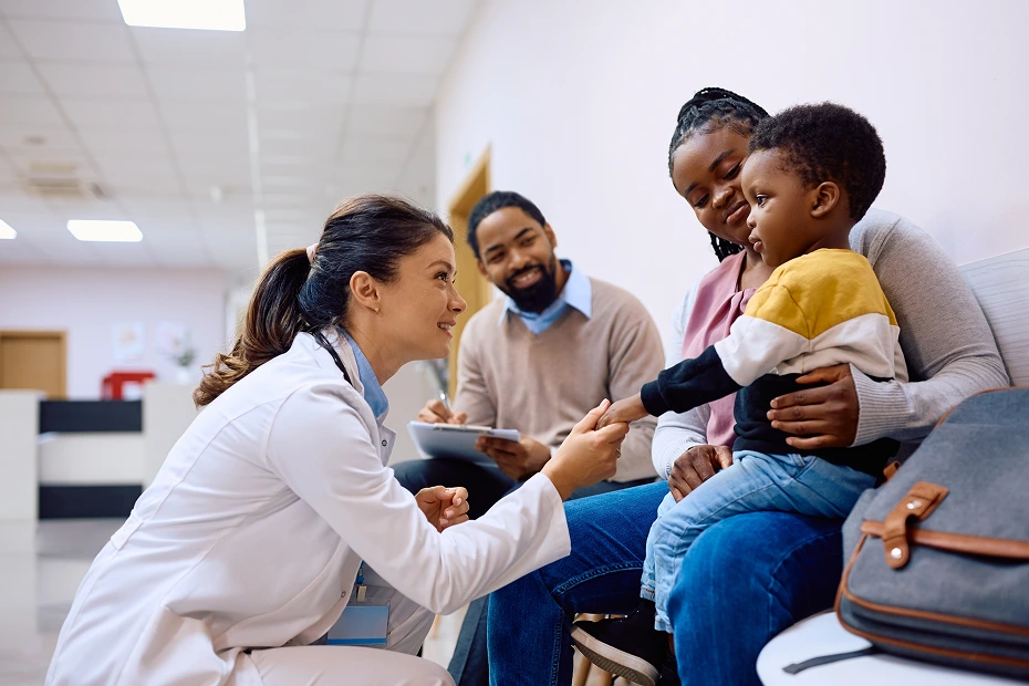 kid getting checked up by a doctor outside the hall