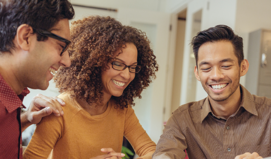 Group of Bloom and Soar staff discussing the implementation plan.