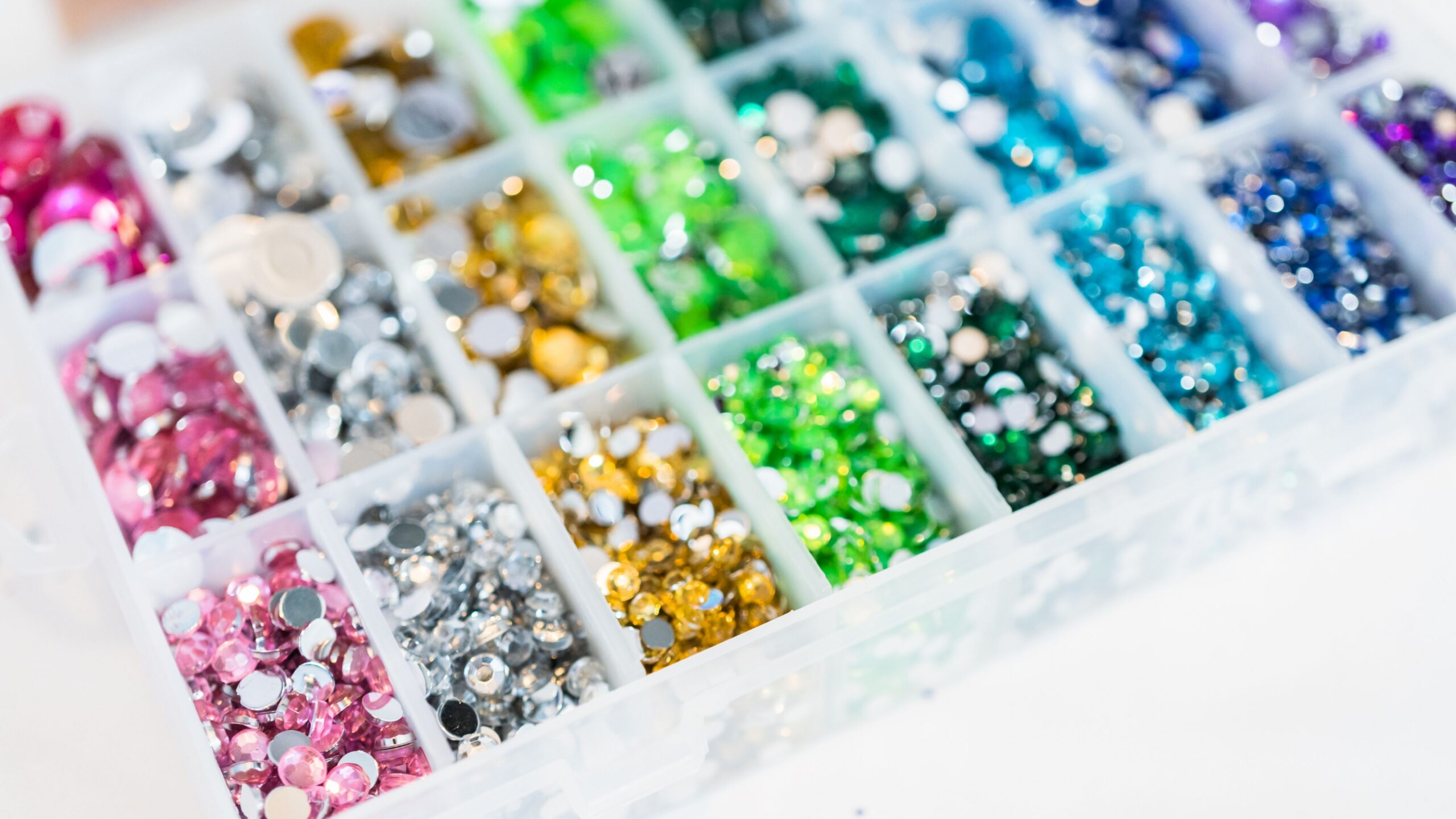 Rhinestone kit in a rainbow of colors for DIY bedazzled prescription bottles.