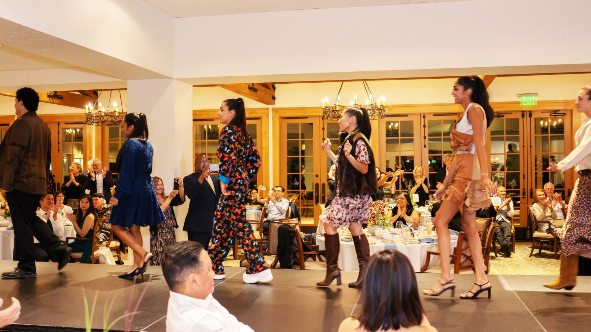 fashion show models walk the runway